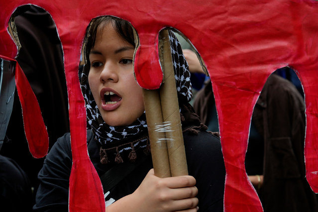 A demonstrator carries a sign at a protest against Israeli Prime Minister Benjamin Netanyahu during the 79th session of the United Nations General Assembly, Thursday, September 26, 2024, in New York. (Photo by Julia Demaree Nikhinson/AP Photo)