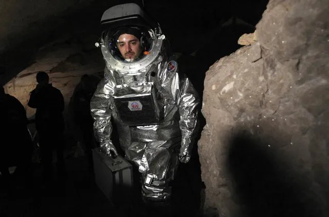 Physicist Daniel Schildhammer wears the Aouda.X spacesuit simulator during a field test inside Austria's Dachstein ice caves on April 28, 2012