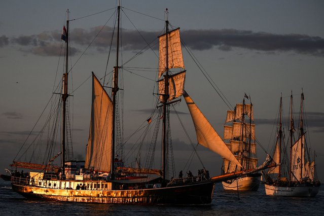 Tall ships participate in the 32nd Hanse Sail maritime festival in Rostock-Warnemuende, Germany, 10 August 2023. The largest annual traditional sailors' meeting in the world will take place from 10 to 13 August 2023. About 250 sailboats, steamboats and ships pass by the Warnemuende pier as they travel back and forth around Rostock's harbors. (Photo by Filip Singer/EPA)