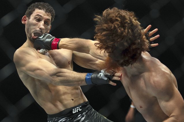 Shara Magomedov, right, punches Armen Petrosyan during a middleweight mixed martial arts bout at UFC Fight Night on Saturday, October 26, 2024, in Abu Dhabi, United Arab Emirates. (Photo by Altaf Qadri/AP Photo)