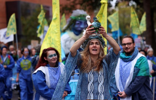 People participate in a clean water march outside the Parliament in London, Britain, 03 November 2024. People from across the UK gathered to protest the condition of the nation's rivers and seas. The March for Clean Water, organized by River Action, is urging the government to ensure access to clean water across the UK. (Photo by Andy Rain/EPA/EFE)