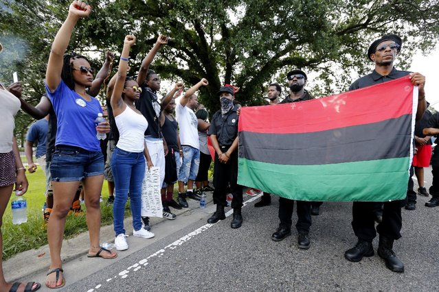 Demonstrators protest the shooting death of Alton Sterling near the headquarters of the Baton Rouge Police Department in Baton Rouge, Louisiana, U.S. July 9, 2016. (Photo by Jonathan Bachman/Reuters)
