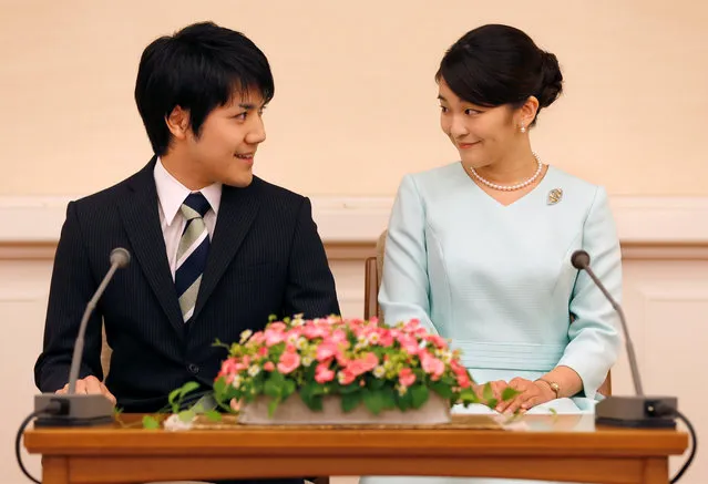 Princess Mako, the elder daughter of Prince Akishino and Princess Kiko, and her fiancee Kei Komuro, a university friend of Princess Mako, smile during a press conference to announce their engagement at Akasaka East Residence in Tokyo, Japan, September 3, 2017. Princess Mako, a granddaughter of the emperor and empress, expressed delight with her engagement to her fiance, Kei Komuro, as the young couple exchanged smiles at a news conference. (Photo by Shizuo Kambayashi/Reuters)