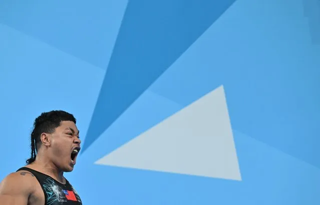 Samoa's Jack Hitila Opeloge celebrates while competing in the Men's 109kg snatch weightlifting event on day six of the Commonwealth Games at the NEC Arena in Birmingham, central England, on August 3, 2022. (Photo by Glyn Kirk/AFP Photo)