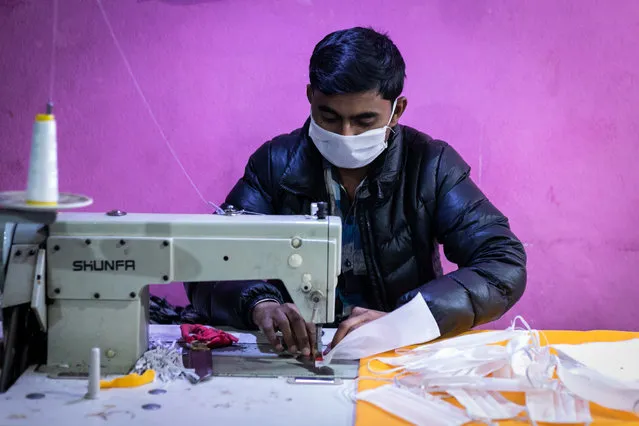 A factory worker making fabric face masks in Kathmandu, Nepal on March 7, 2020. Local factories are producing fabric mask to meet with demands as the COVID-19 coronavirus World Health Organisation (WHO) announced 98,192 people worldwide have been diagnosed with the corona virus (COVID-19) disease as of 6, March 2020. (Photo by Prabin Ranabhat/SOPA Images/SIPA Press)
