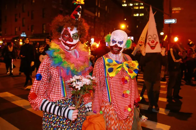 Gruesome clowns are seen in the 44th annual Village Halloween Parade in New York City on Tuesday, October 31, 2017. (Photo by Gordon Donovan/Yahoo News)