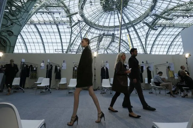 A model walks backstage before the presentation of designer Marcel Marongiu Spring/Summer 2015 women's ready-to-wear collection for Guy Laroche fashion house at the Grand Palais during Paris Fashion Week September 24, 2014. (Photo by Gonzalo Fuentes/Reuters)