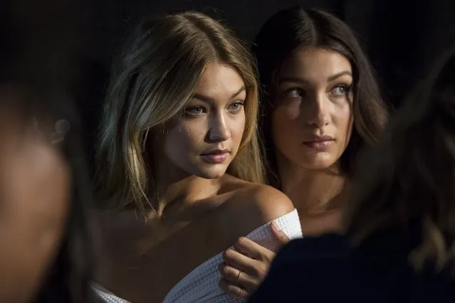 Models Gigi Hadid (L) and Bella Hadid pose for photos backstage before the Tommy Hilfiger Spring/Summer 2016 collection presentation during New York Fashion Week in New York, September 14, 2015. (Photo by Andrew Kelly/Reuters)