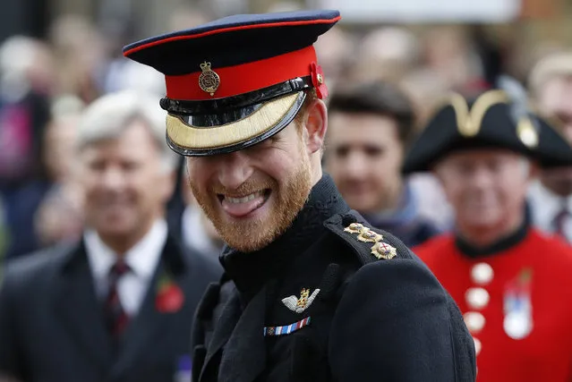 Britain's Prince Harry smiles as he speaks to veterans as he attends the official opening ceremony of The Field of Remembrance at Westminster Abbey in London, Thursday, November 9, 2017. (Photo by Kirsty Wigglesworth/AP Photo)
