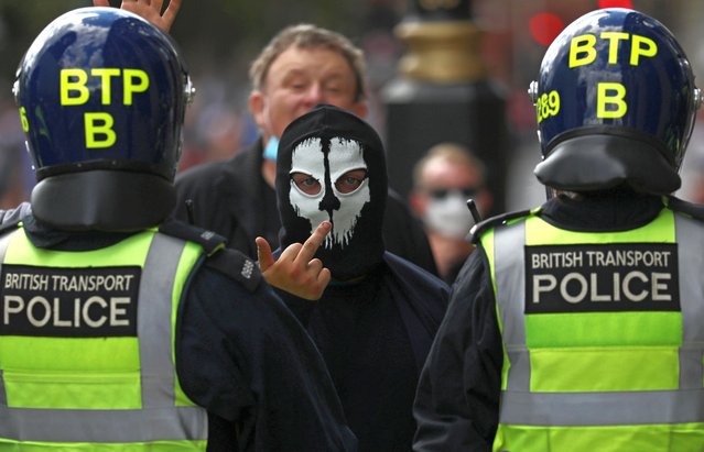 A counter-protester gestures during a Black Lives Matter protest following the death of George Floyd in Minneapolis police custody, in London, Britain, June 13, 2020. (Photo by Simon Dawson/Reuters)