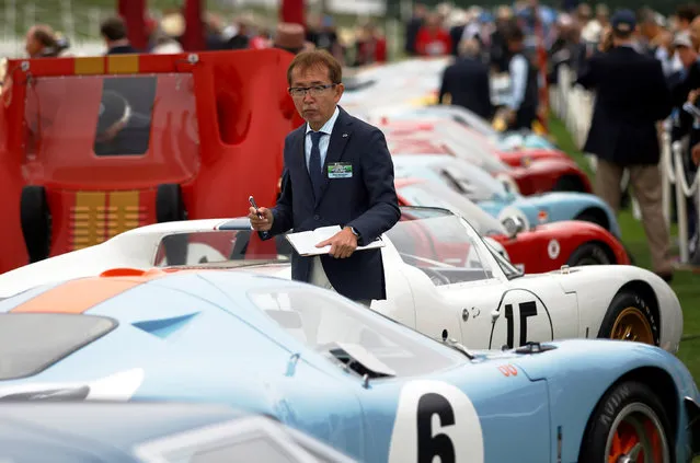 Honorary Judge and Senior Vice President of Nissan Motor Co. Shiro Nakamura judges the Ford GT40 class during the Concours d'Elegance in Pebble Beach, California, U.S. August 21, 2016. (Photo by Michael Fiala/Reuters/Courtesy of The Revs Institute)