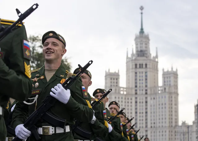 Russian soldiers march toward Red Square to attend a dress rehearsal for the Victory Day military parade in Moscow, Russia, Saturday, June 20, 2020. The military parade marking the 75th anniversary of the Nazi defeat was postponed from May 9 due to the outbreak of the coronavirus pandemic and is now set to take place on June 24. (Photo by Alexander Zemlianichenko/AP Photo)