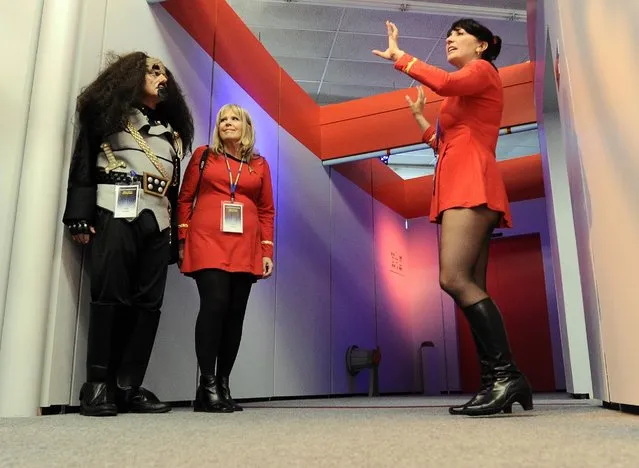 In this Saturday, August 13, 2016 photo, Bud Fisher, left, and his wife Kathy Fisher, center, of Enfield, Conn., dressed in “Star Trek” costumes take a guided tour of the replica Starship Enterprise with tour guide Marybeth Ritkouski, right, of Pepperell, Mass., during the Trekonderoga festival in Ticonderoga, N.Y. (Photo by Hans Pennink/AP Photo)