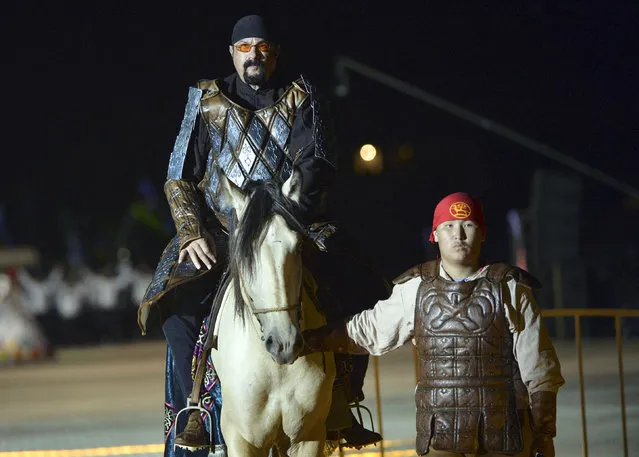 In this photo taken on Saturday, September 3, 2016, U.S. actor Steven Seagal rides a horse during the opening ceremony of the second World Nomad Games at Issyk Kul lake in Cholpon-Ata, Kyrgyzstan. (Photo by Vladimir Voronin/AP Photo)