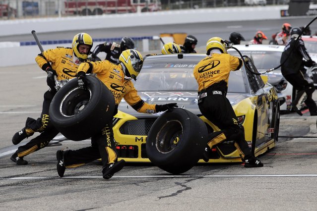 The pit crew scrambles as driver Brad Keselowski makes a pitstop during a NASCAR Cup Series auto race, Sunday, August 2, 2020, at the New Hampshire Motor Speedway in Loudon, N.H. (Photo by Charles Krupa/AP Photo)
