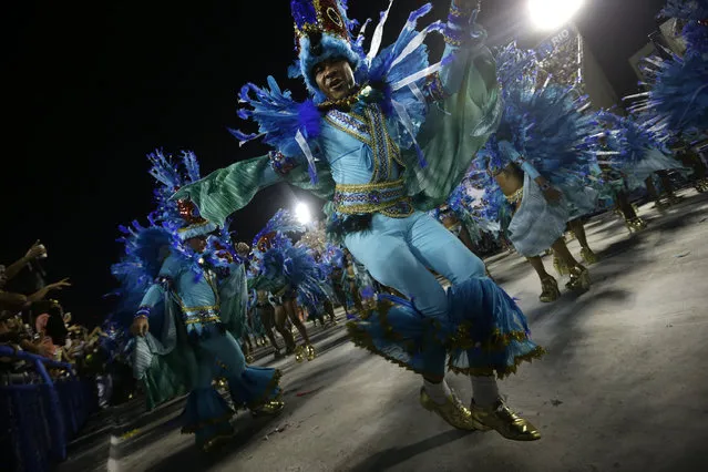 Performers from the Unidos de Vila Isabel samba school parade during Carnival celebrations at the Sambadrome in Rio de Janeiro, Tuesday, February 12, 2013. Rio de Janeiro's samba schools vied for the title of the year's best in an over-the-top, all-night-long Carnival parade at the city's iconic Sambadrome. (Photo by Silvia Izquierdo/AP Photo)