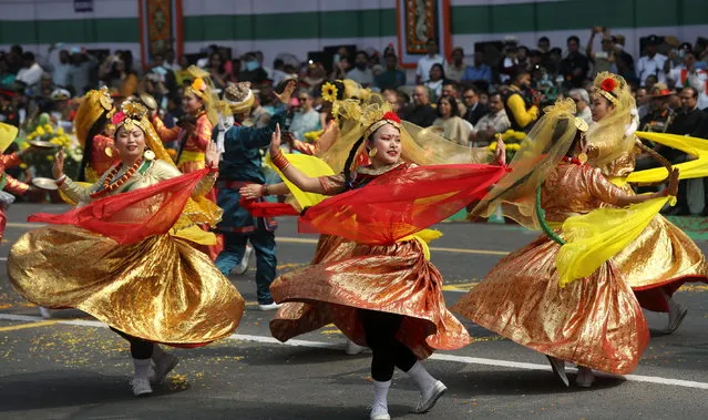 Indian students perform a dance during a Republic Day parade at the Red Road in the eastern Indian city of in  Kolkata, India, 26 January 2023. (Photo by Piyal Adhikary/EPA/EFE)