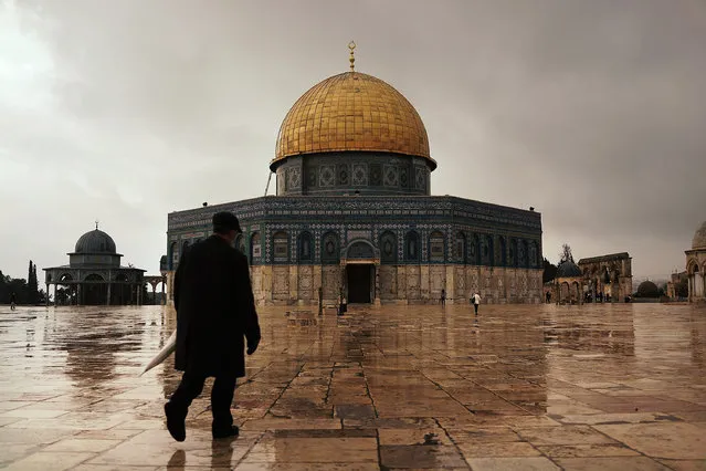 A man walks towards the Dome of the Rock at the Al-Aqsa mosque compound in the Old City on November 27, 2014 in Jerusalem, Israel. The Dome of the Rock is the fought over holy site between Jews and Muslims and is the prime attraction of the Haram es-Sharif (Noble Sanctuary) or Temple Mount, which is also sacred to Jews. (Photo by Spencer Platt/Getty Images)