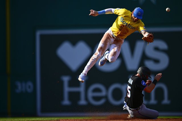 Troy Johnston #75 of the Miami Marlins slides safely into second base against Trevor Story #10 of the Boston Red Sox in the third inning at Fenway Park on August 16, 2025 in Boston, Massachusetts. (Photo by Jaiden Tripi/Getty Images)