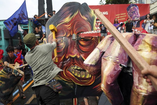 Protesters destroy an effigy of Philippine President Ferdinand Marcos Jr.'s State of the Nation Address in Quezon City, Philippines on Monday, July 28, 2025. (Photo by Basilio Sepe/AP Photo)