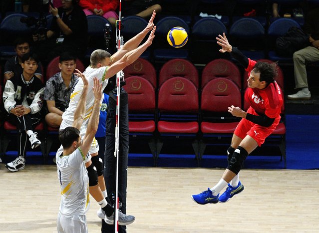 Algeria’s Youssouf Bourouba in action at Men’s World Volleyball Championships with Ukraine’s Illia Kovalov and Maksym Drozd at Smart Araneta Coliseum in Quezon City, Philippines on September 16, 2025. (Photo by Noel Celis/Reuters)