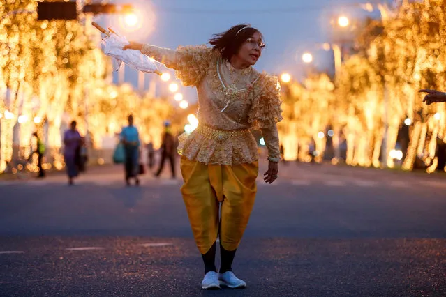 A woman dressed in traditional Thai costume walks at the Royal Plaza, as interest for historical clothing rises within the country, in Bangkok, Thailand April 6, 2018. (Photo by Soe Zeya Tun/Reuters)