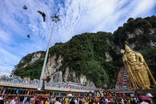 Malaysian Hindu devotees carry milk pots and kavadis as they walk towards Sri Subramaniar Swamy Temple during the Thaipusam festival at Batu Caves on February 05, 2023 in Selangor, Malaysia. After two years of celebrating Thaipusam on a small scale due to the COVID-19 pandemic, the Hindu festival is back in full celebration as devotees commemorate the day when the goddess Parvathi gave her son Lord Murugan a powerful lance to fight for good over evil. The annual procession by Hindu devotees involve piercing parts of their body such as their cheeks, tongues, and backs before carrying kavadi or milk pots on a journey of faith to seek blessings. (Photo by Annice Lyn/Getty Images)