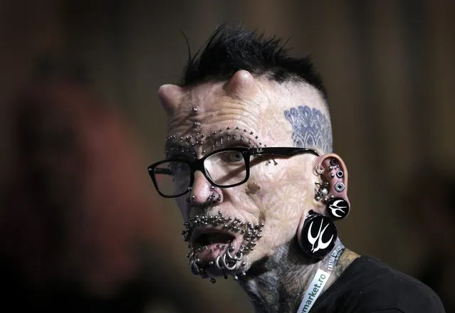 Rolf Buchholz from Germnay, the Guiness Book record holder for the most pierced man in the world (453 piercings), attends, as a special guest, a tattoo convention in Bucharest, Romania, 15 October 2016. (Photo by Robert Ghement/EPA)