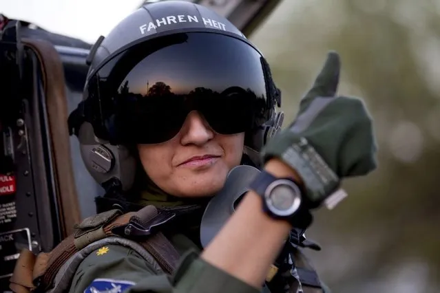 Ayesha Farooq, 26, Pakistan's only female war-ready fighter pilot, gives the thumb-up sign from the cockpit of a Chinese-made F-7PG fighter jet at Mushaf base in Sargodha, north Pakistan June 6, 2013. Farooq, from Punjab province's historic city of Bahawalpur, is one of 19 women who have become pilots in the Pakistan Air Force over the last decade – there are five other female fighter pilots, but they have yet to take the final tests to qualify for combat. A growing number of women have joined Pakistan's defence forces in recent years as attitudes towards women change. (Photo by Zohra Bensemra/Reuters)