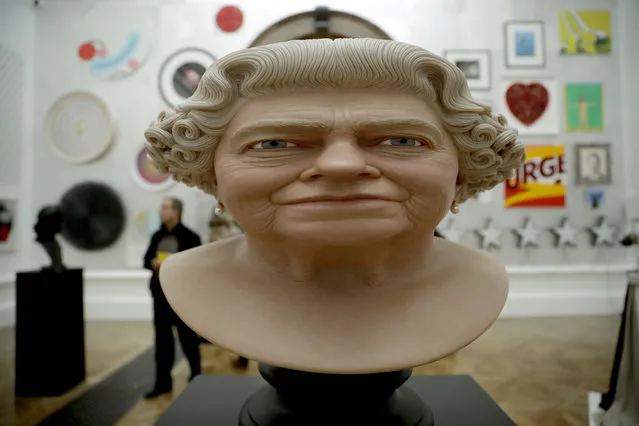 “The Queen” painted fibreglass by artist John Humphreys is displayed backdropped by other works which feature in this year's Summer Exhibition on it's 250th year at the Royal Academy of Arts in London, Tuesday, June 5, 2018. The Summer Exhibition has been held since 1769, with around 1300 works on display this year and most of them available for purchase. It runs from June 12 until August 19. (Photo by Matt Dunham/AP Photo)