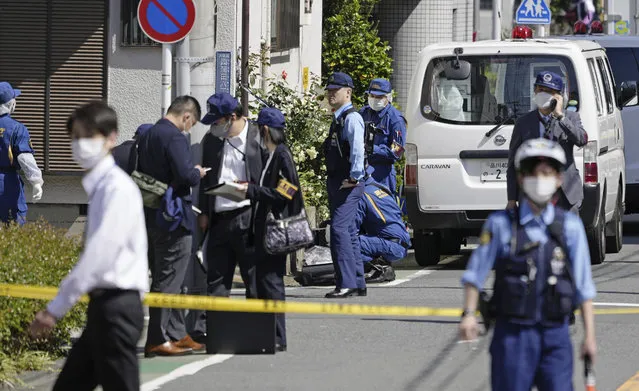 Japanese police investigators work at an area near a stabbing scene in Tokyo, Wednesday, May 10, 2023. Japanese police said a schoolboy was stabbed in the chest as he stepped out of his house to go to school Wednesday in a residential area of downtown Tokyo. A suspect was arrested at the scene. (Photo by Takaki Yajima/Kyodo News via AP Photo)