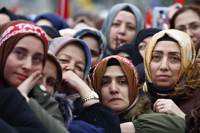 Supporters listen as Turkish president, Recep Tayyip Erdoğan holds a rally ahead of the Presidential elections in the Sultangazi area of Istanbul on May 12, 2023 in Istanbul, Turkey. Erdogan will face his biggest electoral test as voters head to the polls in the country's general election. Erdogan has been in power for more than two decades, as prime minister and then as president, but his popularity has taken a hit recently due to Turkey's ongoing economic crisis and his government's handling of series of devastating earthquakes that struck the country's southeast in early February. (Photo by Jeff J. Mitchell/Getty Images)