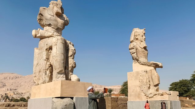 Two colossal alabaster statues of ancient Egyptian King Amenhotep III are re-erected at his mortuary temple on Luxor's West Bank, Luxor, Egypt, 14 December 2025. Each statue stands over 10 metres tall and weighs around 100 tonnes. (Photo by EPA/EFE/Stringer)