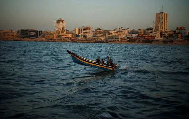 Men ride their boat at the Seaport of Gaza City, October 13, 2016. (Photo by Suhaib Salem/Reuters)