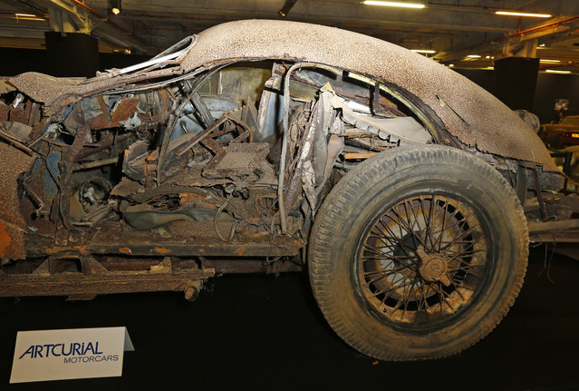 Talbot Lago T26 Grand sport SWB Saoutichik is displayed for auction during the  Retromobile show in Paris, Tuesday, February 3, 2015. 60 rusting motors, which include a vintage Ferrari California Spider, a Bugatti and a very rare Maserati, were found gathering dust and hidden under piles of newspapers in garages and outbuildings at a property in France.  (Photo by Jacques Brinon/AP Photo)