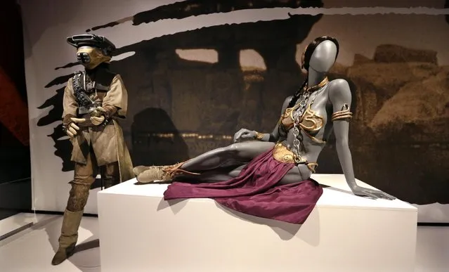 In this photo taken Thursday, January 29, 2015, Princess Leia's slave bikini, right, and her Boushh disguise are displayed as part of an exhibit on the costumes of Star Wars at Seattle’s EMP Museum. (Photo by Elaine Thompson/AP Photo)