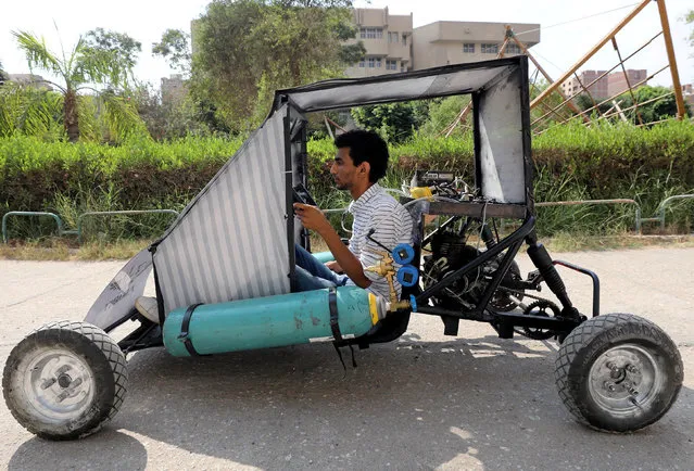 Mahmoud Yasser, mechanical engineering student from Helwan University, drives the air-powered vehicle which he helped design to promote clean energy and battle increasing gas prices, in Cairo, Egypt on August 7, 2018. (Photo by Mohamed Abd El Ghany/Reuters)