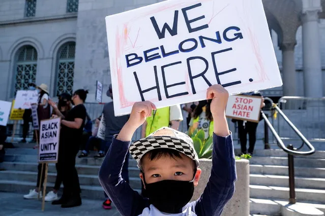 A young demonstrator holds a sign during a rally against anti-Asian hate crimes outside City Hall in Los Angeles, California, U.S. March 27, 2021. (Photo by Ringo Chiu/Reuters)