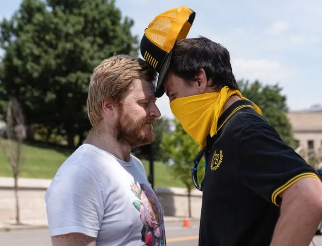 A member of the Proud Boys presses his head against the head of a person he is arguing with in front of the Tennessee State Capitol ahead of a special session on public safety in Nashville, Tennessee, U.S., August 21, 2023. (Photo by Cheney Orr/Reuters)
