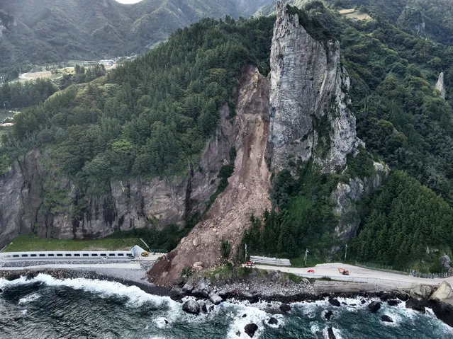 A handout photo made available by the Ulleung County office on 24 September 2023, shows the damage in the aftermath of a mudslide that hit a road on the country's eastern island of Ulleung earlier the same day. (Photo by Ulleung County Office/EPA/EFE)