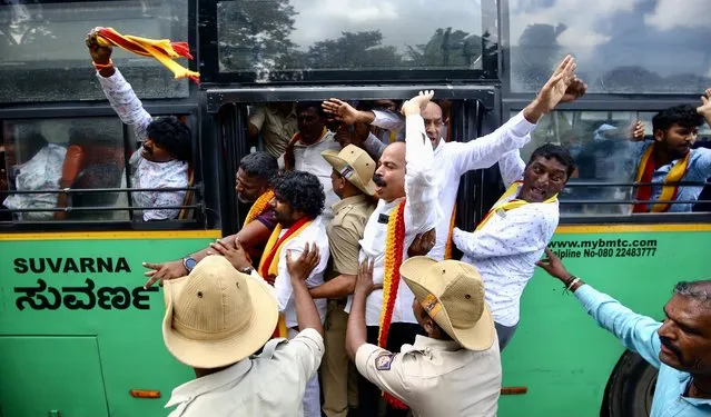 Indian police force pro-Kannada activists into a bus during a protest against the Supreme Court's order on the Cauvery river water dispute and Tamil Nadu chief minister in Bangalore, India, 26 September 2023. Hundreds of farmers and pro-Kannada activists staged a protest calling for a “Bangalore Bandh” and Section 144 implemented across the city, following the Indian Supreme Court's order and the Cauvery Water Management Authority (CWMA) order directed Karnataka to continue releasing 5,000 cusecs of water to Tamil Nadu for another 15 days. (Photo by Jagadeesh N.V./EPA)