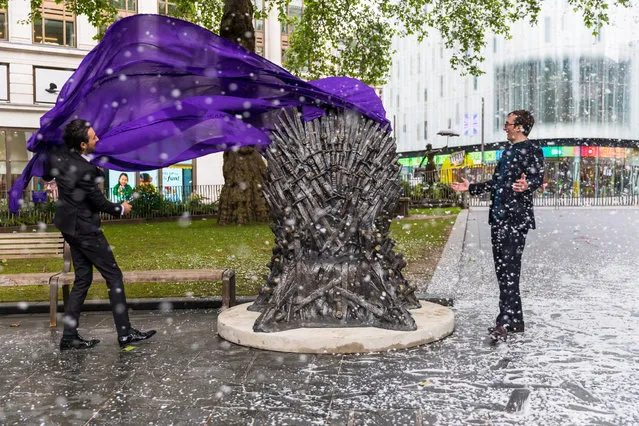 British television presenter Alex Zane (L) and British actor Isaac Hempstead Wright (R) during the Game Of Thrones Iron Statue unveiling photocall in Leicester Square, London, Britain, 22 June 2021. The Iron Throne statue marks the tenth anniversary of the Game of Thrones and is the final statue unveiled as part of Leicester Square's “Scenes in the Square”. (Photo by Vickie Flores/EPA/EFE)
