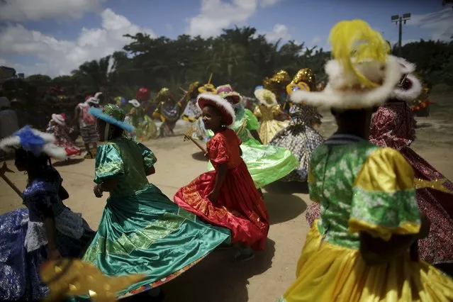 Revellers dance during a traditional Maracatu carnival in Olinda, Brazil February 8, 2016. (Photo by Ueslei Marcelino/Reuters)