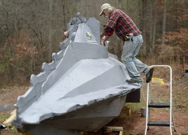 Danny McWilliams, 56, works on his 36-foot-long replica of Walt Disney movie version of the Nautilus submarine from Jules Verne's “20,000 Leagues Under the Sea” at his rural home in Ellijay, Georgia, USA, 04 December 2013. (Photo by Erik S. Lesser/EPA)