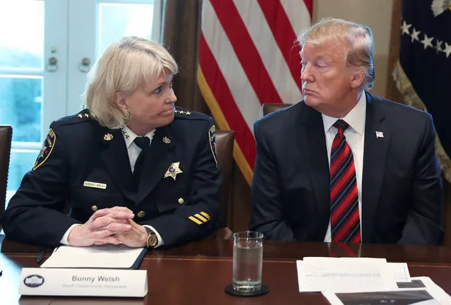 U.S. President Donald Trump listens to Chester County, Pennsylvania Sheriff Bunny Welsh during a “roundtable discussion on border security and safe communities” with state, local, and community leaders in the Cabinet Room of the White House in Washington, U.S., January 11, 2019. (Photo by Leah Millis/Reuters)