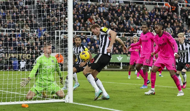 Newcastle United's Dan Burn scores his side's third goal during the Premier League match between Newcastle United and Fulham FC at St. James Park on December 16, 2023 in Newcastle upon Tyne, England. (Photo by Alex Dodd - CameraSport via Getty Images)