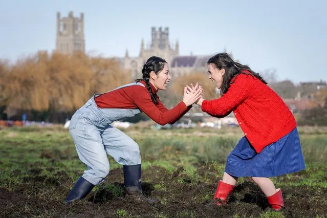 Yuwei Jing and Zoe Villiers put on their wellingtons in Cambridge, UK on January 22, 2024, to raise awareness of the threat climate change poses to the marshlands in the Fens. The actresses are starring in Home, a play that was a hit on the Edinburgh Festival Fringe last year. (Photo by Guy Corbishley/Alamy Live News)