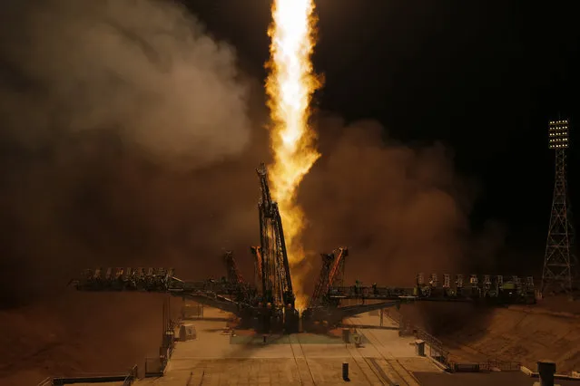 The Soyuz-FG rocket booster with Soyuz MS-12 space ship carrying a new crew to the International Space Station, ISS, blasts off at the Russian leased Baikonur cosmodrome, Kazakhstan, early Friday, March 15, 2019. The Russian rocket carries U.S. astronauts Christina Hammock Koch, Nick Hague, and Russian cosmonaut Alexey Ovchinin. (Photo by Dmitri Lovetsky/AP Photo)