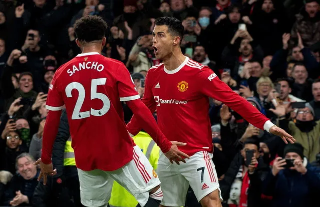 Manchester United's Cristiano Ronaldo celebrates after scoring the 3-2 during the English Premier League soccer match between Manchester United and Arsenal FC in Manchester, Britain, 02 December 2021. (Photo by Peter Powell/EPA/EFE)