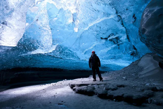 A view of Rob Lott standing in the crystal ice cave in the Vatnajokull Glacier, Iceland. (Photo by Rob Lott/Barcroft Media)